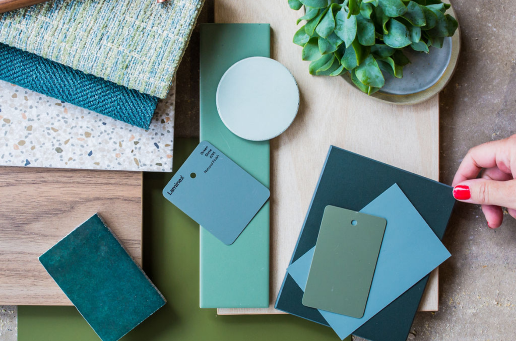 A collection of paint and fabric swatches, tiles and timber finishes