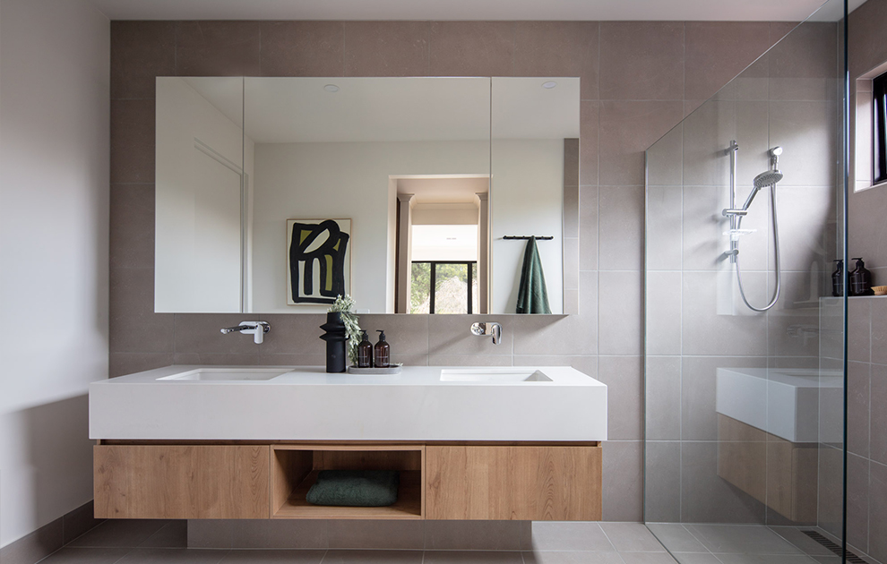 Bathroom with double vanity and shower