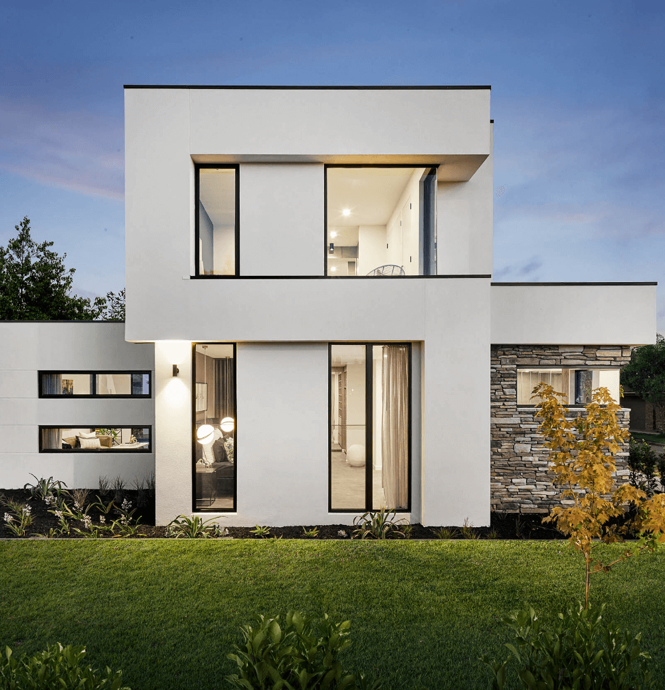 Double storey home with white exterior and flagstone wall
