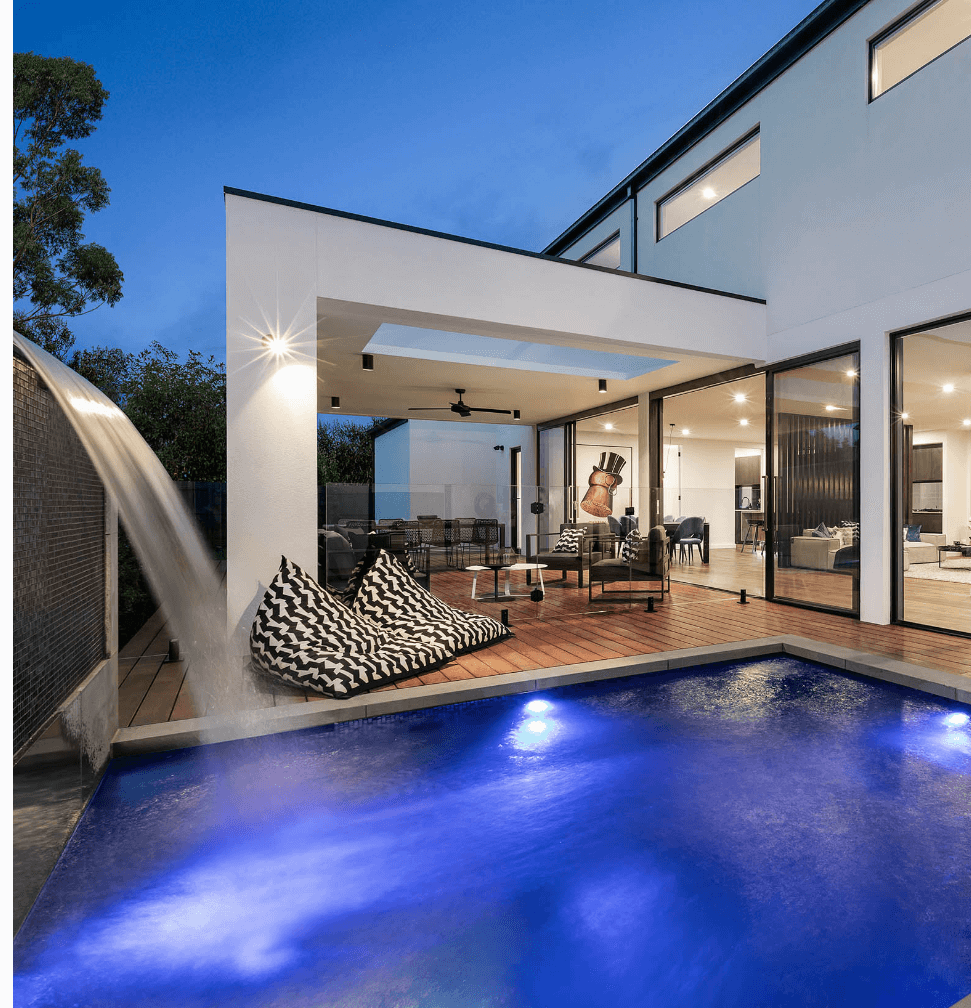 Rear of modern home with outdoor living area and blue plunge pool 