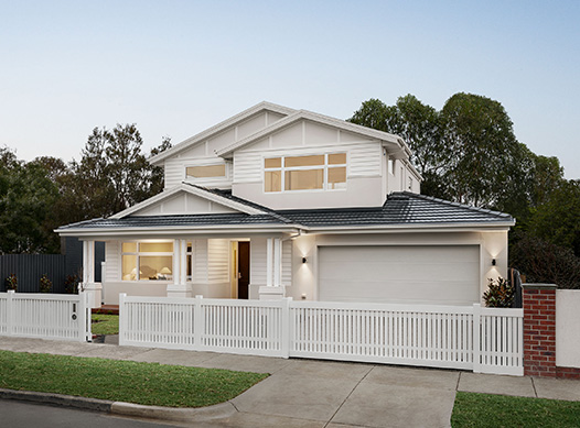 Medhurst facade: Double storey home with white and cream exterior, grey roof and white picket fence