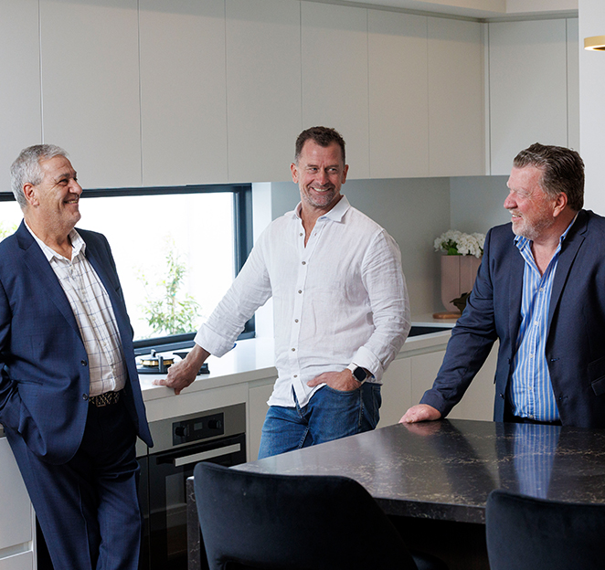 Carter Grange founders and directors standing outside a custom dual occupancy home