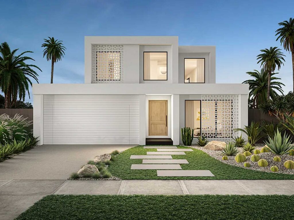 Modern white two-story home with large windows, decorative lattice panels, and a wooden front door amid desert landscaping and palm trees.