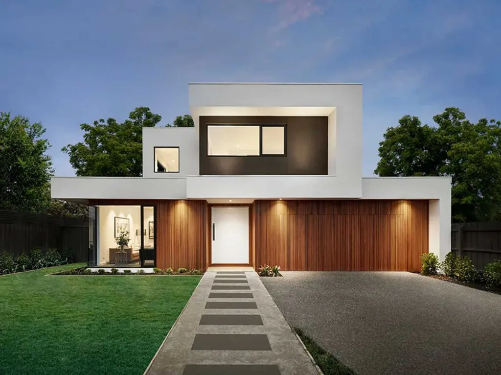 Modern white and wood-clad two-story house with a large central window and a stepped stone path to the front door.